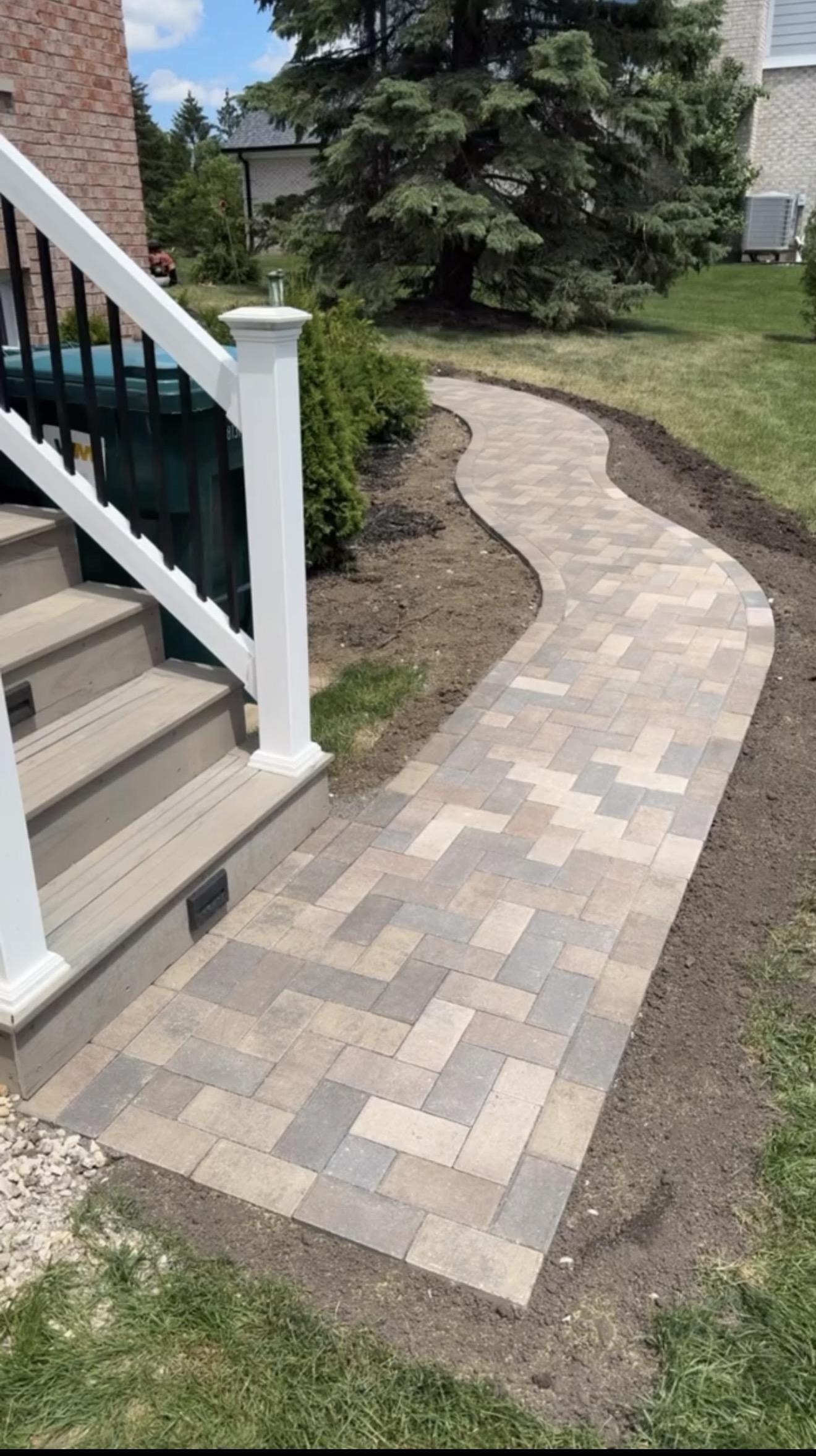 Curved walkway with steps and railing